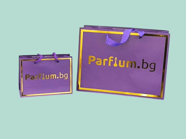 Luxury branded paper bags with cord and ribbon handles with gold foil