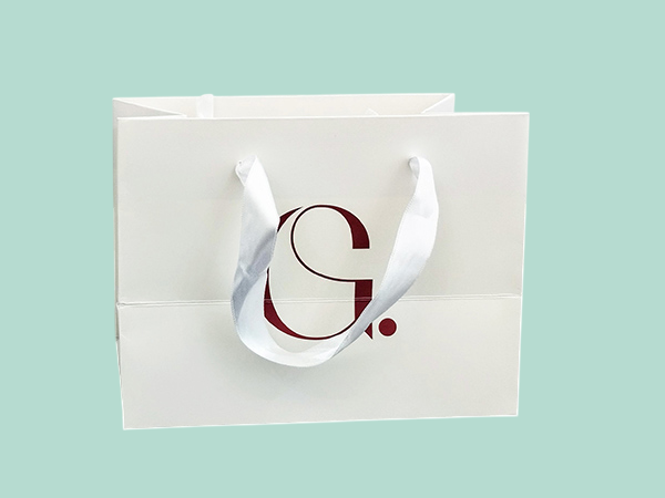 Personalized luxury branded paper bags with satin ribbons