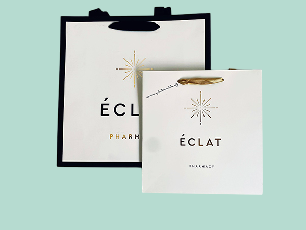 Personalized luxury branded paper bags with satin ribbons
