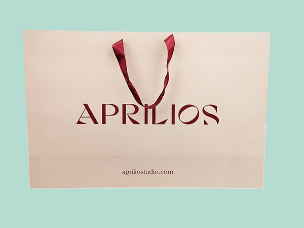Luxury branded paper bags with cord and gold foil