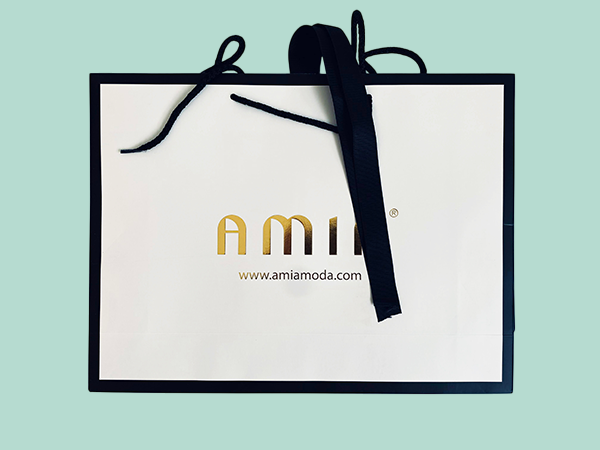 Luxury branded paper bags with cord and ribbon handles with gold foil