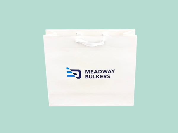 Luxury branded paper bags with textile ribbon handles